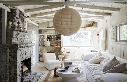 white living room with big round pendant light