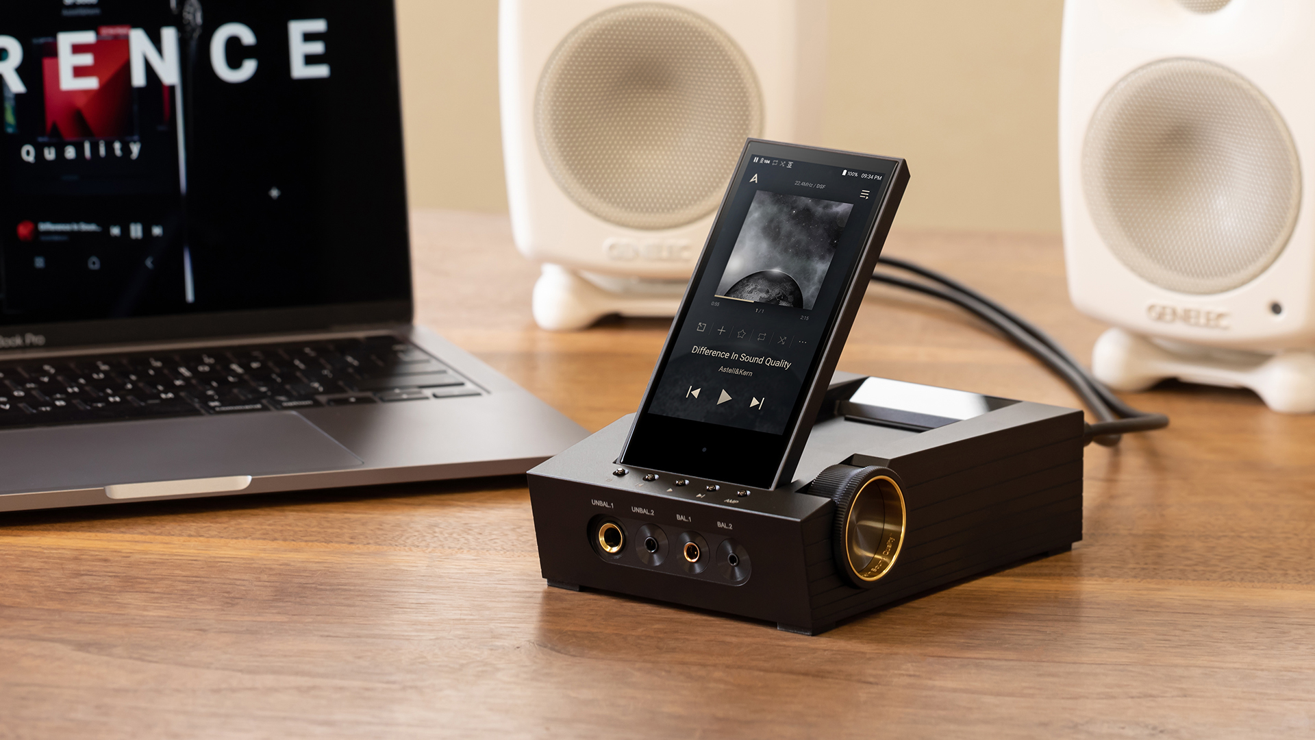 Astell&Kern CA1000T on a desktop with white speakers and laptop