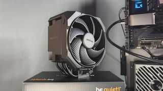 Be Quiet's latest air coolers on a box with black fans.