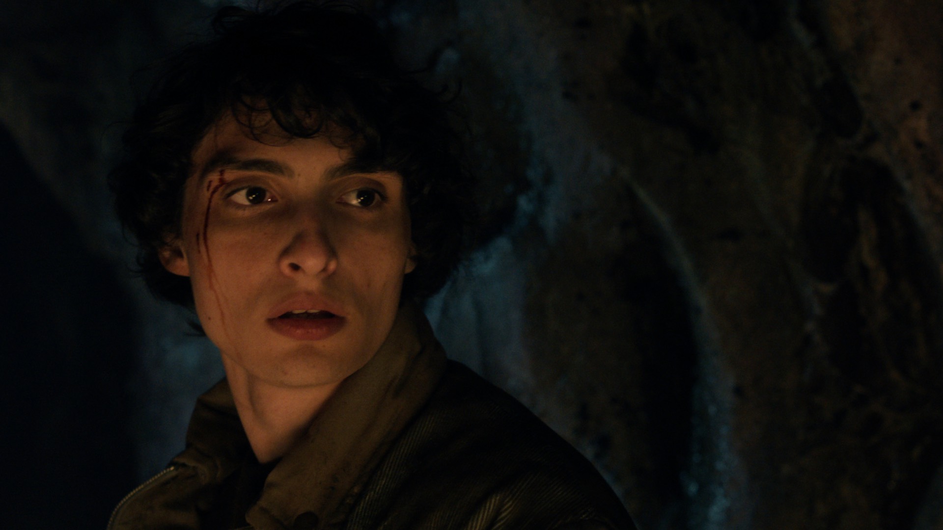 Mike Wheeler in a tunnel with a cut forehead