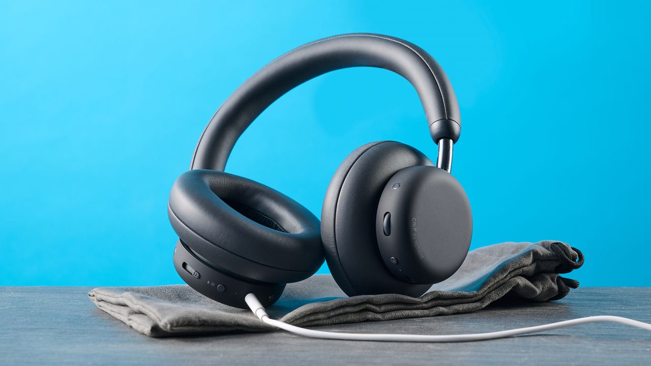 the cmf headphone pro / cmf by nothing headphone pro / nothing headphone pro in black photographed against a blue tom's guide background