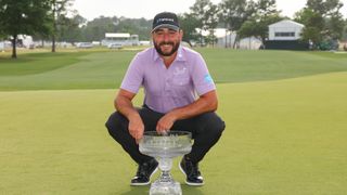 Stephan Jaeger poses for a photograph with the Texas Children's Houston Open trophy