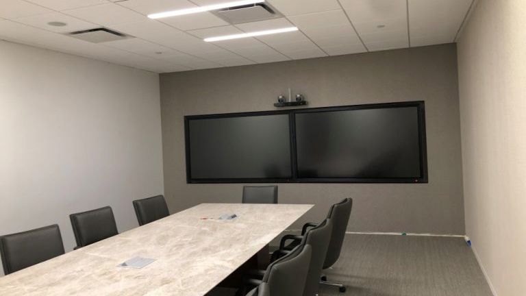 Data Projections prepared its client’s office space for a virtual trial, configuring a state-of-the-art conference facility with a sophisticated web of interconnected monitors, interactive displays, control panels, an integrated sound system, and streaming capabilities.