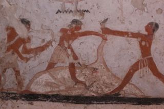 In this painting from Hetpet's tomb, three men appear to be in the process of slaughtering a cow.
