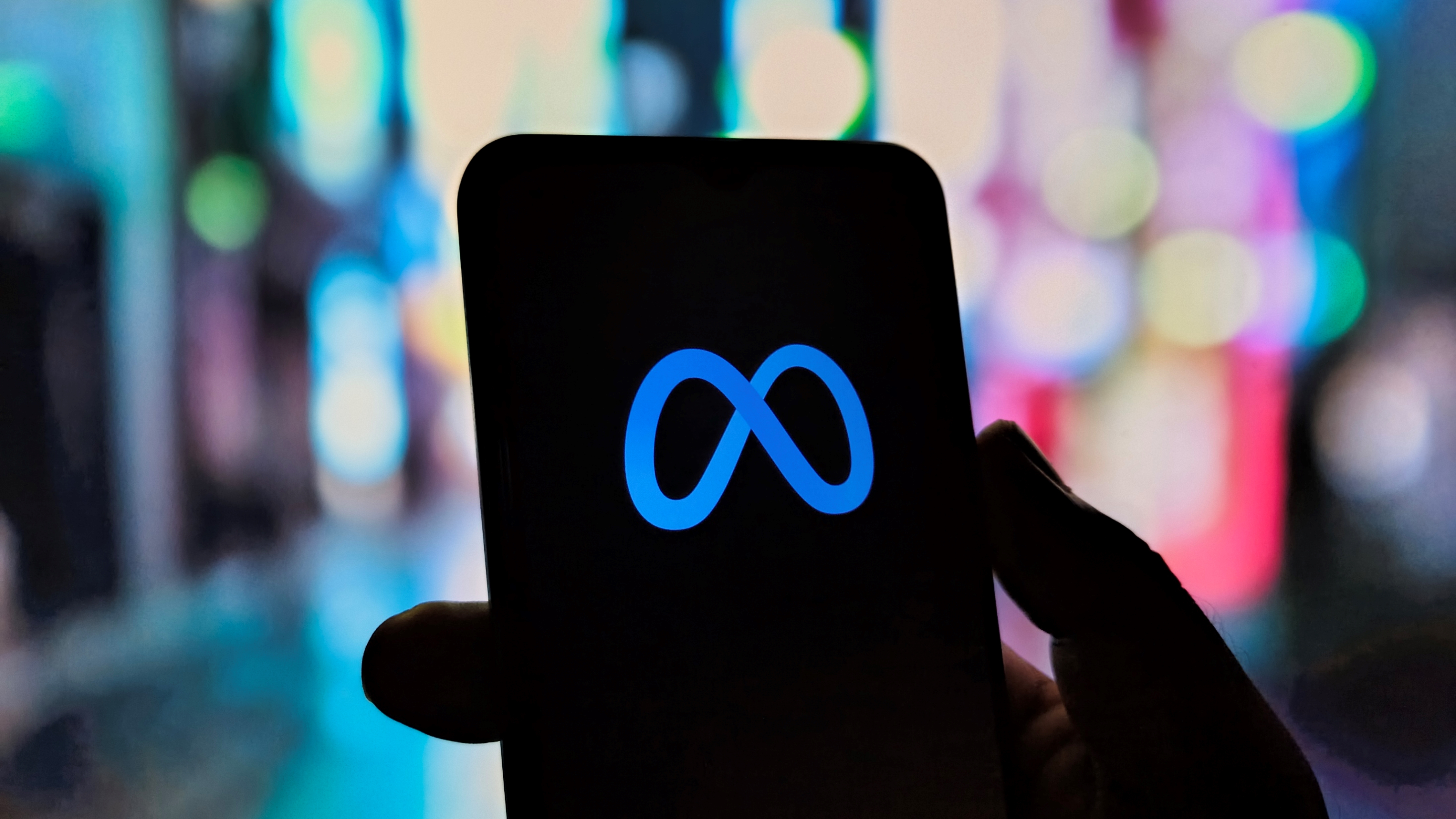 This illustrates digital connectivity with a mobile device, highlighting the Meta platform, signifying modern communication, virtual reality, and engagement in the metaverse. Captured on 13 July 2025; Shutterstock ID 2652715669; purchase_order: -; job: -; client: -; other: