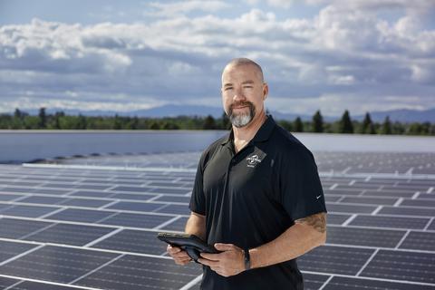 Comcast man with solar panels