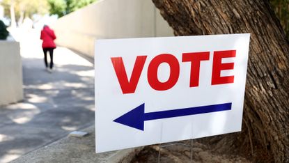 Voters directed towards a polling station in Orange County, California 