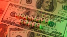 interest rates green red hundred dollar bills