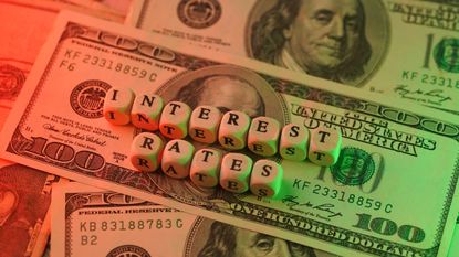 interest rates green red hundred dollar bills