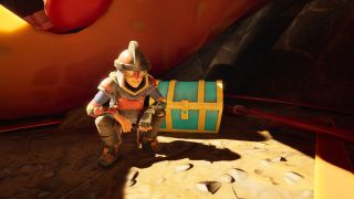 Grounded 2 Sizzling Key: A character wearing heavy armour crouched down next to a blue and gold chest, with their hands hanging off their knees.