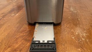 Breville Bit More 4-Slice Toaster with crumbs in tray