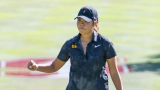 Jasmine Koo celebrates holing a putt