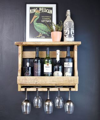 blue wall with drink shelf and drinks and wine glass