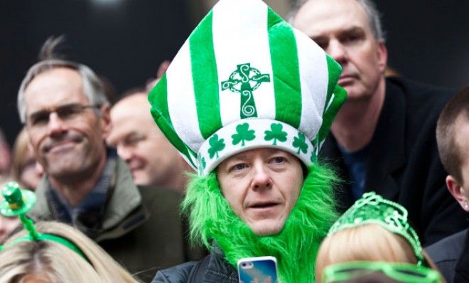 Revelers watch the 252nd annual St. Patrick&amp;#039;s Day Parade in New York City on Saturday.