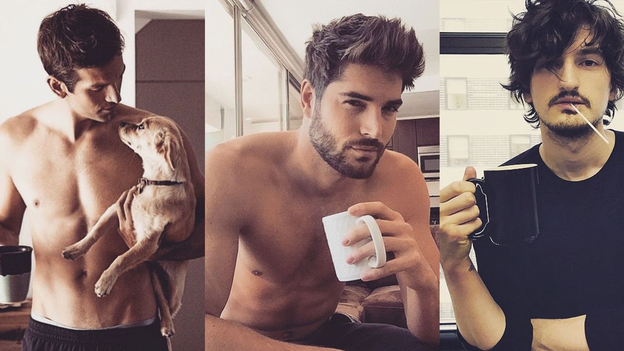 Three men posing with coffee cups.