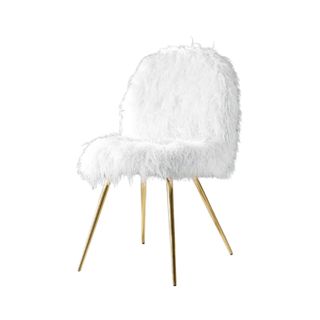 A faux white chair with gold legs