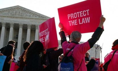 Pro-ObamaCare protesters demonstrate outside the Supreme Court