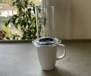 AeroPress coffee maker on a coffee mug