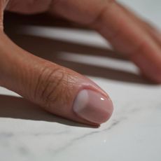 @iramshelton wearing a sheer, milky nail polish