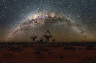 Dishes of the Australian Square Kilometer Array Pathfinder telescope, with the Milky Way overhead.
