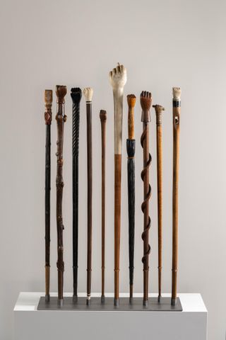 ten hand-carved walking sticks