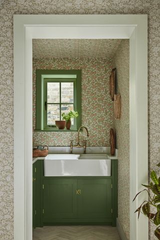 small utility room with printed wallpaper by Little Greene