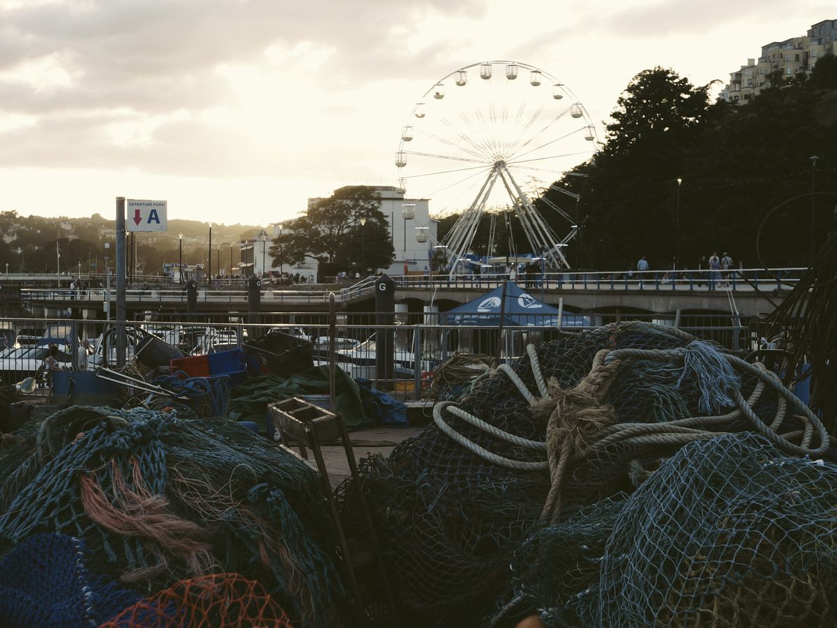 Sample image taken with the Panasonic Lumix L10; a collection of fishing nets in foreground, the Torquay 'eye' ride behind them