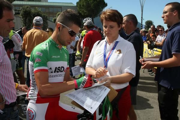 Italian champion Giovanni Visconti (ISD-Neri) signs autographs before the start