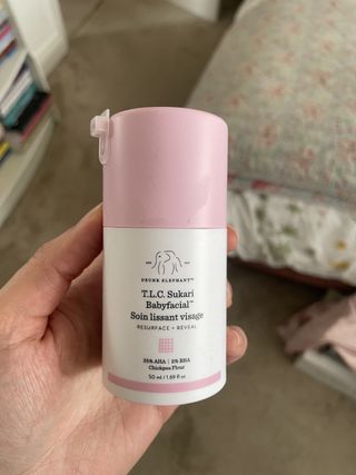 Mica Ricketts holding Drunk Elephant T.L.C. Sukari Babyfacial