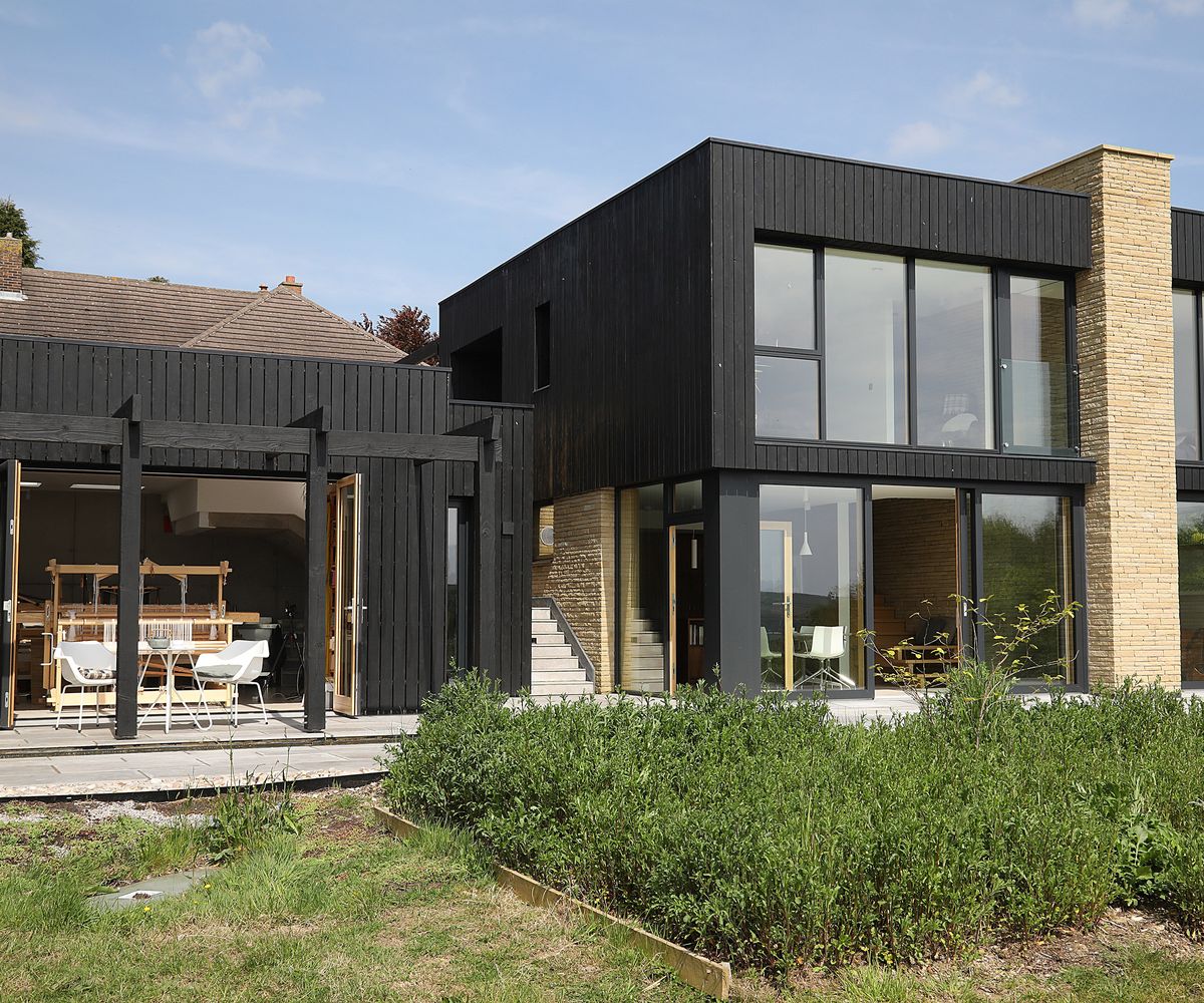 A contemporary two storey self build with a smaller separate workspace