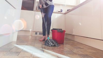 mopping the floor in the kitchen