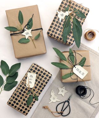 Presents wrapped in a brown wrapping paper with leaf tags