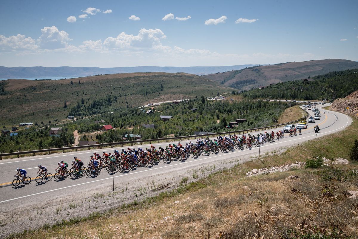The peloton on a long highway climb