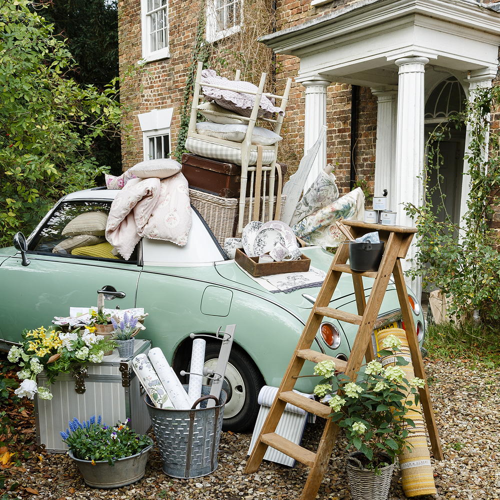garden area with van and ladder with flower pot