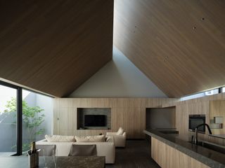 timber clad dramatic pitched roof in japanese house
