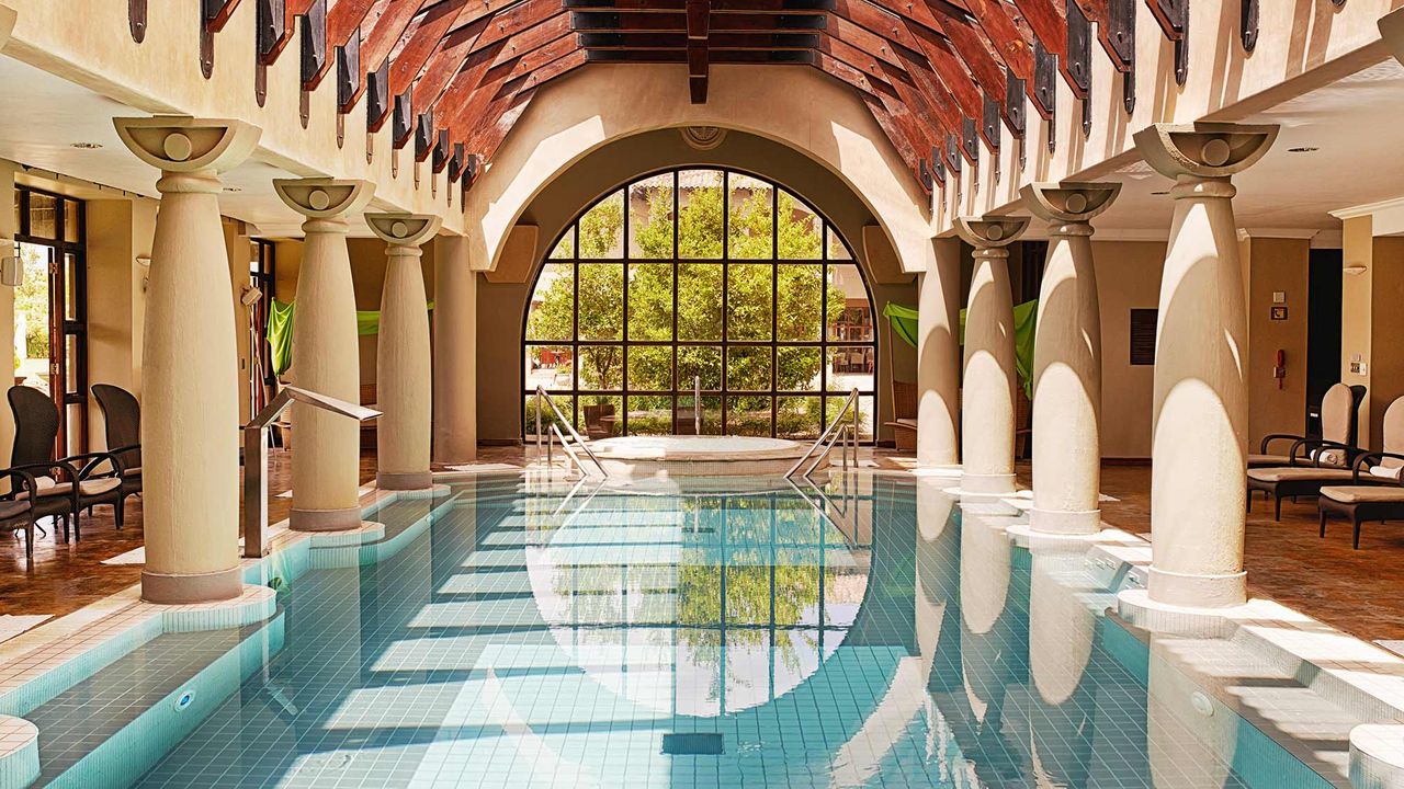 Shot of an indoor swimming pool at a health spa