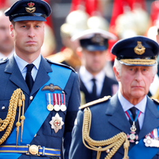 Prince William, Prince of Wales and King Charles III walk behind Queen Elizabeth II's coffin