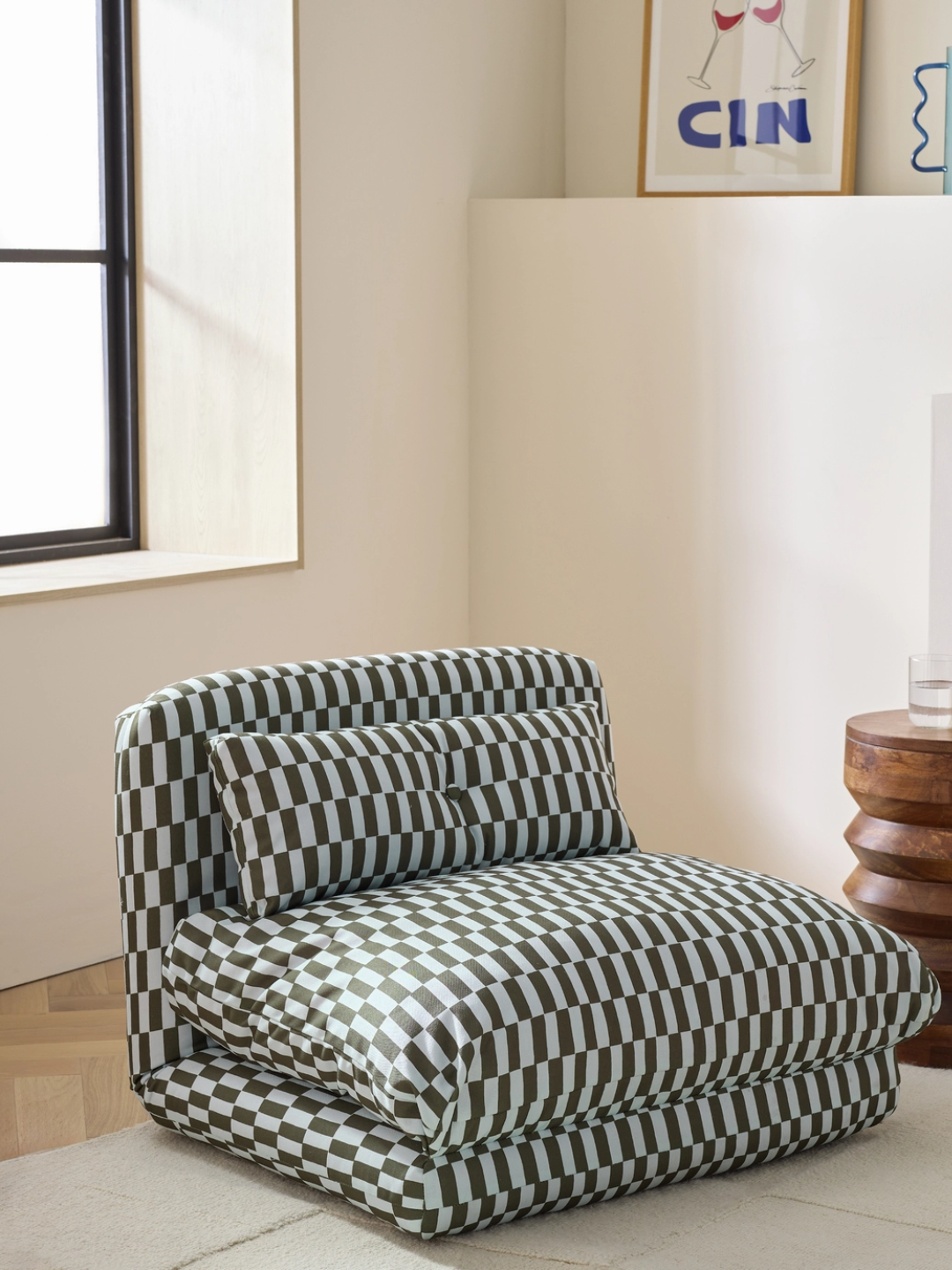 A blue and green checkered chair bed