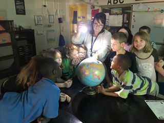 Students at Carruthers Elementary School get a hands-on lesson about the total solar eclipse.