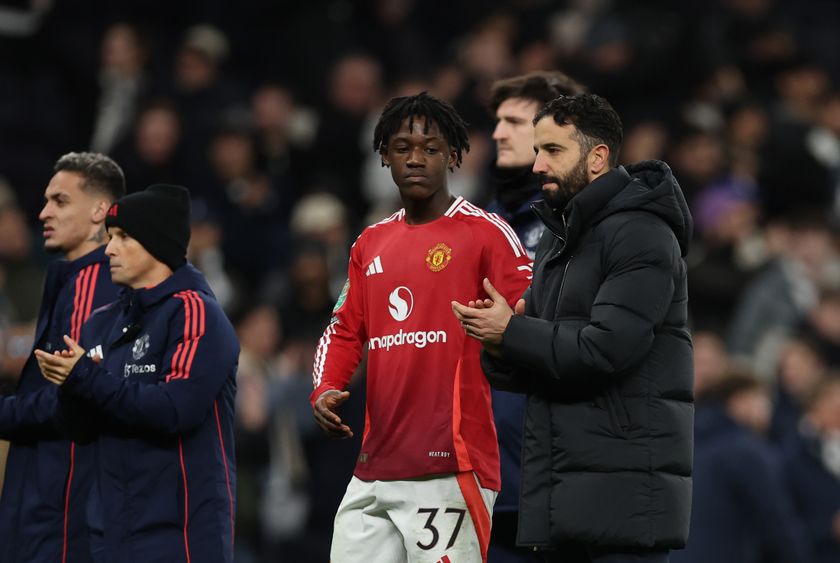 Manchester United boss Ruben Amorim alongside midfielder Kobbie Mainoo