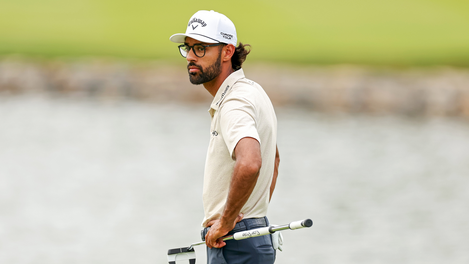 Akshay Bhatia waits to hit a putt on the green