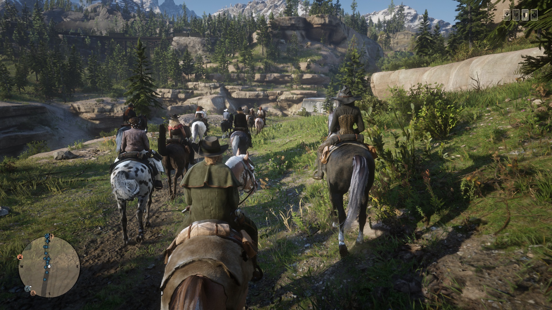 Red Dead Online - Several players ride slowly together along a dirt path through a grassy area.