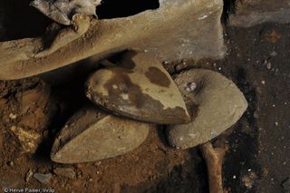 These heart-shaped lead urns were unearthed in a cemetery in northwestern France.