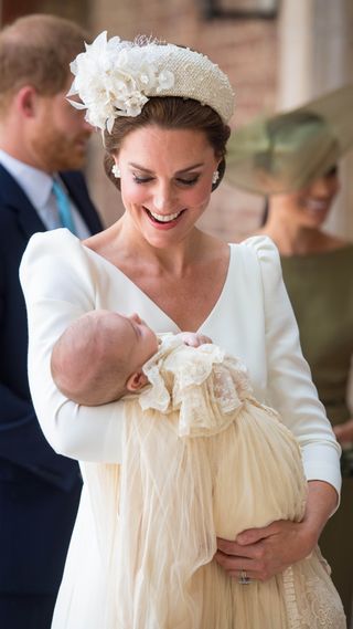 Kate Middleton holding Prince Louis at his Christening