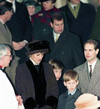 Princess Diana wearing a brown coat and hat trimmed with black fur standing. next to Prince William, Prince Harry, Prince Andrew and Prince Edward outside of church