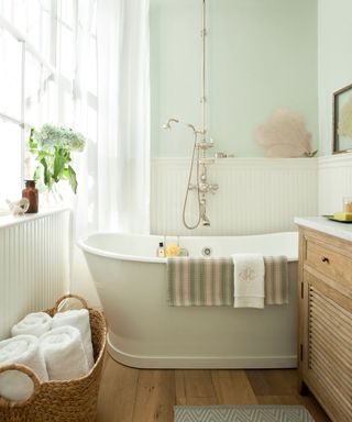 Warm neutrals bathroom scheme with floaty sheer panel window dressing