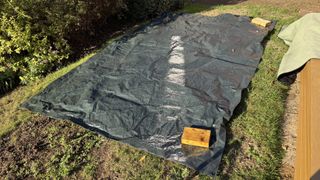 I tried the 'tarp burrito' method to clear leaves from my yard &mdash; and it's a game changer