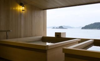 wooden hot tub with view out over water