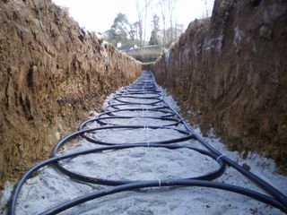 a slinkie trench for a ground source heat pump array