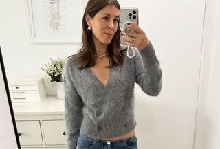 Judith Jones in gray J.Crew cardigan sweater.